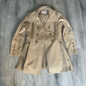 Small Woman’s, Calvin Klein hooded overcoat.Pleated bottom with hidden pockets.